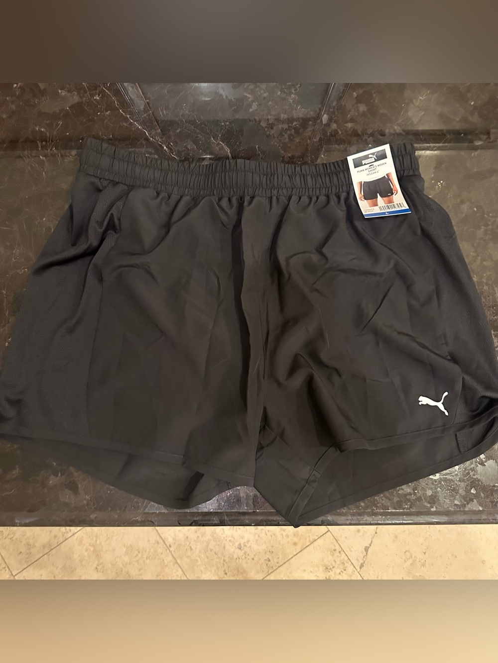 Puma women’s Black Athletic Shorts with White Logo
